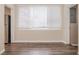 Bright dining room with large window and modern wood-look flooring at 4111 13Th S Ave, St Petersburg, FL 33711
