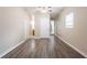 Hallway featuring neutral walls, wood-look floors, and white trim at 4111 13Th S Ave, St Petersburg, FL 33711
