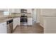 Modern kitchen featuring stainless steel appliances, granite countertops, and ample cabinet space at 4111 13Th S Ave, St Petersburg, FL 33711