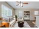 Bright living room featuring a ceiling fan, large windows, and stylish black-and-white decor at 4111 13Th S Ave, St Petersburg, FL 33711