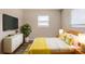 Tastefully decorated main bedroom featuring a large bed, TV, dresser, and neutral decor at 4111 13Th S Ave, St Petersburg, FL 33711