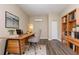 Office featuring a wood desk, modern chair, and stylish bookshelf at 4111 13Th S Ave, St Petersburg, FL 33711