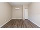 Neutral room featuring modern wood-look flooring, mini split AC, and closet at 4111 13Th S Ave, St Petersburg, FL 33711
