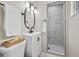 Bathroom features modern vanity, oval mirror, and tiled shower at 5629 36Th N Ave, St Petersburg, FL 33710