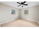 Bedroom has light wood flooring and neutral walls with two windows providing plenty of light at 5629 36Th N Ave, St Petersburg, FL 33710