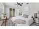 Bright bedroom with closet, ceiling fan, and modern decor, creating a cozy and inviting space at 5629 36Th N Ave, St Petersburg, FL 33710