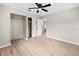 Spacious bedroom with ceiling fan, closet and light wood flooring offering a simple design at 5629 36Th N Ave, St Petersburg, FL 33710