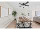 Open-concept dining area with a rustic wooden table and stylish decor at 5629 36Th N Ave, St Petersburg, FL 33710