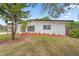 Charming single-story home boasts a freshly painted white brick exterior and well-manicured landscaping at 5629 36Th N Ave, St Petersburg, FL 33710
