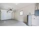 Spacious garage featuring a light gray painted floor and a white paneled garage door with automatic opener at 5629 36Th N Ave, St Petersburg, FL 33710