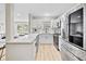 Contemporary kitchen featuring white countertops, stainless appliances, and stylish fixtures at 5629 36Th N Ave, St Petersburg, FL 33710