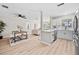 Modern kitchen with white cabinets, stainless steel appliances, and an open layout at 5629 36Th N Ave, St Petersburg, FL 33710