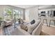 Cozy living room with a large window, plush seating, and modern finishes at 5629 36Th N Ave, St Petersburg, FL 33710