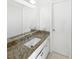 Bathroom featuring granite countertops and modern fixtures, offering a blend of style and functionality at 6623 Baybrooks Cir, Temple Terrace, FL 33617
