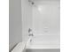 Bright bathroom showcasing a tiled shower with a clean, white finish and modern fixtures at 6623 Baybrooks Cir, Temple Terrace, FL 33617