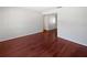 This empty bedroom features hardwood floors, neutral walls and a built-in closet at 6623 Baybrooks Cir, Temple Terrace, FL 33617