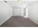This light and airy bedroom features a wall closet and a carpet floor at 6623 Baybrooks Cir, Temple Terrace, FL 33617