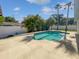 Private backyard with refreshing pool, perfect for relaxation and entertainment with mature landscaping at 6623 Baybrooks Cir, Temple Terrace, FL 33617