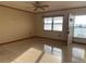 Living room with tile flooring and a ceiling fan, offering a view of the outdoors at 129 104Th Ave # 205, Treasure Island, FL 33706