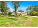 Charming single-Gathering home with well-maintained lawn and inviting curb appeal at 2900 Hammock Dr, Plant City, FL 33566