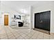 Welcoming foyer with tiled floors and a modern chandelier in dining area at 2900 Hammock Dr, Plant City, FL 33566