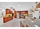 Spacious kitchen with granite countertops, stainless steel appliances, and tile flooring at 2900 Hammock Dr, Plant City, FL 33566