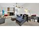 Cozy living room with fireplace, comfortable seating, and natural lighting at 2900 Hammock Dr, Plant City, FL 33566
