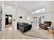 Bright living room featuring tile floors, high ceilings, and a large window at 2900 Hammock Dr, Plant City, FL 33566