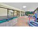 Enclosed sunroom with playset, slide, trampoline and hot tub, perfect for Gathering fun at 2900 Hammock Dr, Plant City, FL 33566