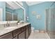 Bathroom boasts double sinks, granite countertop vanity, and a frameless glass shower at 8410 Red Spruce Ave, Riverview, FL 33578