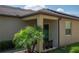 A covered front porch with outdoor seating, a lovely entryway, and curb appeal, creating a warm and inviting welcome at 8410 Red Spruce Ave, Riverview, FL 33578