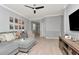 Open living room offers comfortable seating, a media console, and access to the foyer at 8410 Red Spruce Ave, Riverview, FL 33578