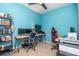Vibrant home office featuring a multi-monitor setup, desk, and ergonomic seating at 8410 Red Spruce Ave, Riverview, FL 33578