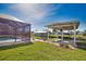 Well maintained lawn and garden with a screened in pool and private boat dock at 1933 Oregon Trl, Englewood, FL 34224