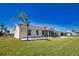 Charming single-story home with a well-manicured lawn and attractive landscaping at 1933 Oregon Trl, Englewood, FL 34224