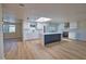 Bright kitchen featuring a skylight, center island and modern finishes at 1933 Oregon Trl, Englewood, FL 34224