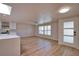 Open-concept living space with modern finishes, wood floors and lots of natural light at 1933 Oregon Trl, Englewood, FL 34224