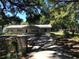 Charming single-story home with a long driveway and beautiful mature trees at 4922 Thonotosassa Rd, Plant City, FL 33565