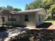 Inviting exterior view showcases well-maintained siding and manicured landscaping at 4922 Thonotosassa Rd, Plant City, FL 33565