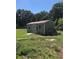 A detached shed in the backyard, providing additional storage space for equipment at 4922 Thonotosassa Rd, Plant City, FL 33565