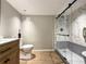 Modern bathroom with frameless glass shower, sleek vanity, and contemporary fixtures at 5141 Oakland Hills Ave, Sarasota, FL 34234