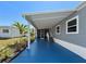 This home features a spacious blue patio, perfect for outdoor living and entertaining at 5141 Oakland Hills Ave, Sarasota, FL 34234