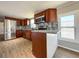 Open concept kitchen featuring stainless steel appliances, granite countertop, and a breakfast bar at 5141 Oakland Hills Ave, Sarasota, FL 34234
