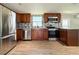 Bright kitchen with stainless steel refrigerator and appliances and ample counter space at 5141 Oakland Hills Ave, Sarasota, FL 34234