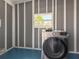 Laundry room features a front load washer and dryer set at 5141 Oakland Hills Ave, Sarasota, FL 34234
