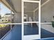 Large screened-in lanai provides unobstructed views of the tropical landscaping at 5141 Oakland Hills Ave, Sarasota, FL 34234
