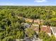 An aerial view showcases the neighborhood's tree-lined streets and residential homes at 7511 Savannah Ln, Tampa, FL 33637