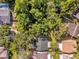 An aerial view shows a home with a lush, tree-filled backyard at 7511 Savannah Ln, Tampa, FL 33637
