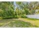 Green grass and a white fence create a peaceful backyard setting at 7511 Savannah Ln, Tampa, FL 33637