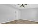 Bright bedroom with a ceiling fan, neutral colors, and modern flooring throughout the room at 7511 Savannah Ln, Tampa, FL 33637